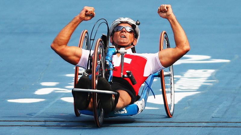 Heinz Frei celebrates his gold in the Road Cycling men's Road Race (HC B) at Beijing 2008 Paralympic Games.