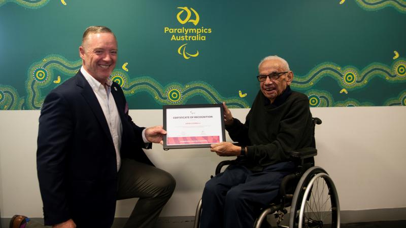 Kevin Coombs OAM receives PLY certificate from Jock O’Callaghan, President of Paralympics Australia