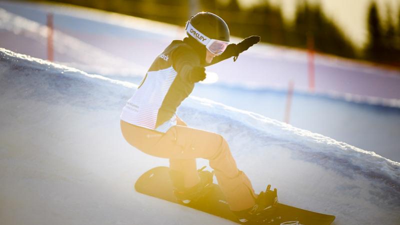 Image of a female Para Snowboard in a competition