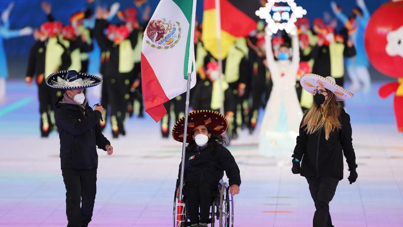 Arly Velasquez carries the Mexican flag at the Opening Ceremony of Beijing 2022