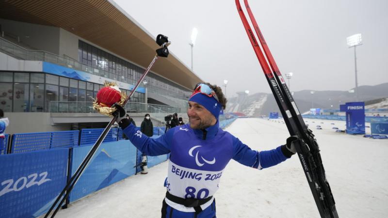 Benjamin Daviet of France celebrates after winning the Para Biathlon Men's Individual Standing at the Beijing 2022 Paralympic Winter Games.