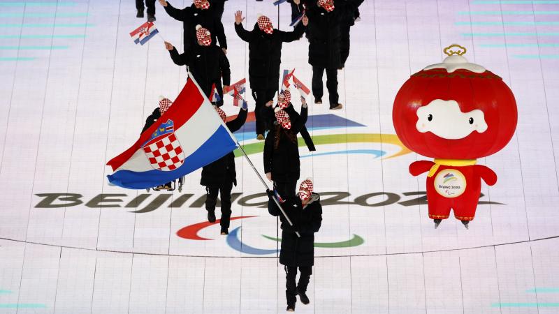 Bruno Bosnjak carrying the Croatian flag at the Opening Ceremony of Beijing 2022