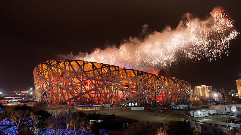 Fireworks emerge from the top of the Birds Nest National Stadium with its metal exoskeleton during the closing ceremony of Beijing 2022