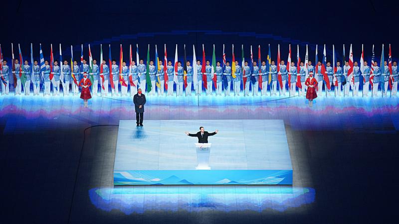 Andrew Parsons is pictured with his arms wide open while speaking during the closing ceremony of Beijing 2022