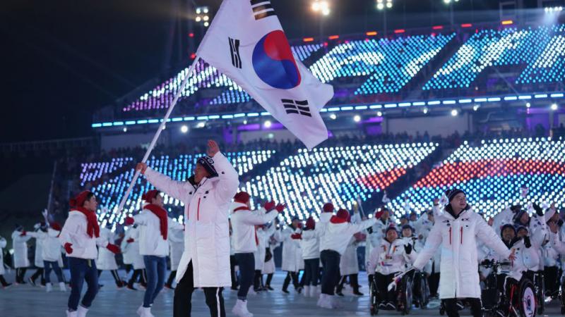 Flag bearer Sin Eui Hyun of South Korea leads the team during the Opening Ceremony of the PyeongChang 2018 Paralympic Winter Games.