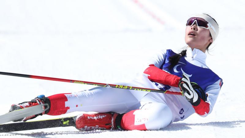 Yujie Guo of China after crossing the finish line in the women's sprint standing Para Biathlon in the Beijing 2022 Games at Zhangjiakou National Biathlon Centre.