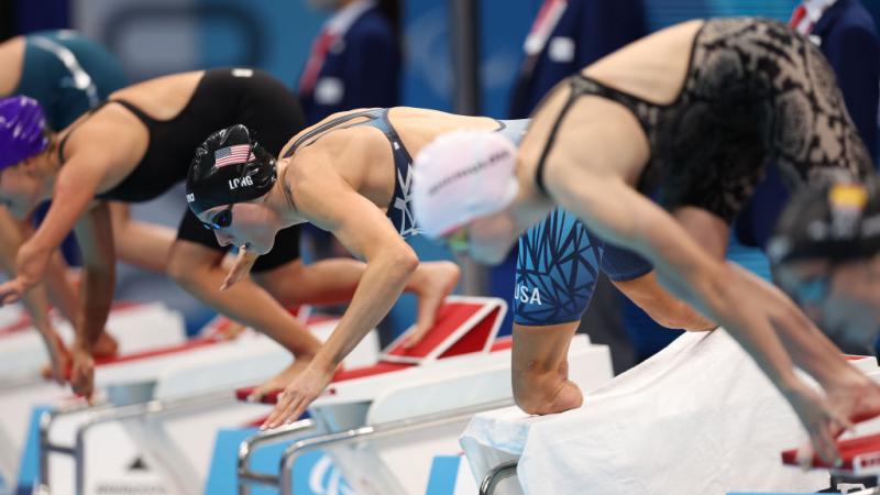 Image of female para swimmers at the beginning of a race
