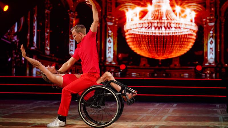 Philip Raabe leans over Birgit Skarstein, taking her and her wheelchair into a dip, as they perform a touching contemporary dance on Norway's SKal vi Danse.