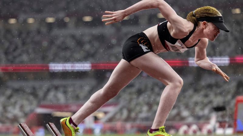 Monica Munga blasts out of the starting blocks on a rainy race day at the Tokyo 2020 Paralympic Games.