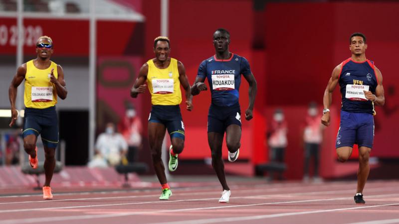 France's Charles-Antoine Kouakou exhales as he powers ahead of the other runners in the men's 400m T20 final at Tokyo 2020.