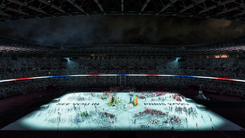 'See you in Paris 2024' is projected on the stadium ground during the Closing Ceremony of Tokyo 2020.