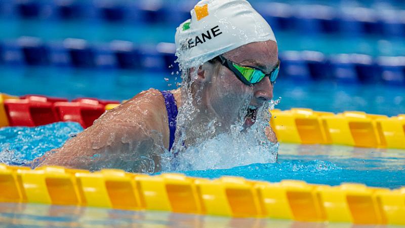 A female swimmer swimming breaststroke