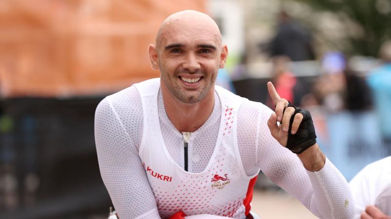 England's Johnboy Smith crossed the finishing line in one hour 41.15 minutes for his first CWG gold.