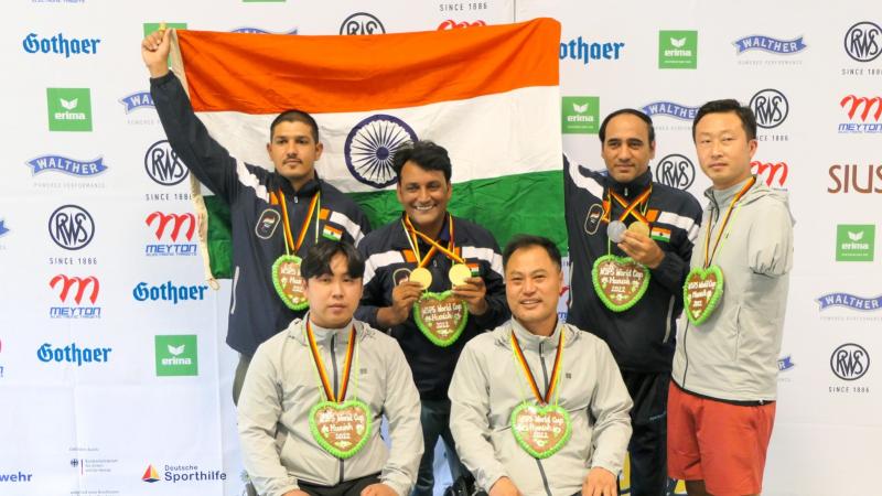 Teams celebrate their medals on podium