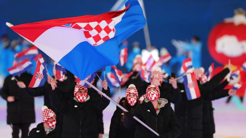 Croatian athletes march out in the athletes' parade at the Opening Ceremony of the Beijing 2022 Paralympic Games.