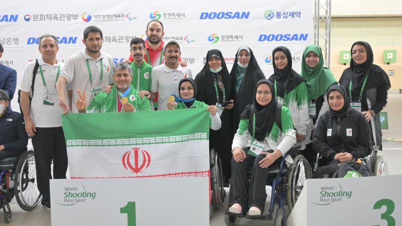 Iran team celebrate their gold medal at podium.