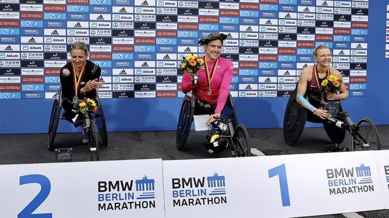 Three female wheelchair racers in the podium of the Berlin Marathon