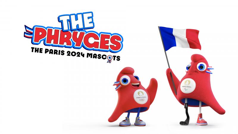 The Olympic Phryge waves while the Paralympic Phryge holds a French flag, with the words "The Phryges: The Paris 2024 Mascots" written in the background.