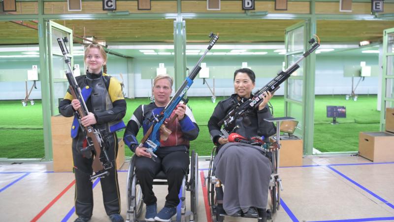 Medallists strike a pose after the end of the R2- women's 10m air rifle SH2 in Al Ain. 
