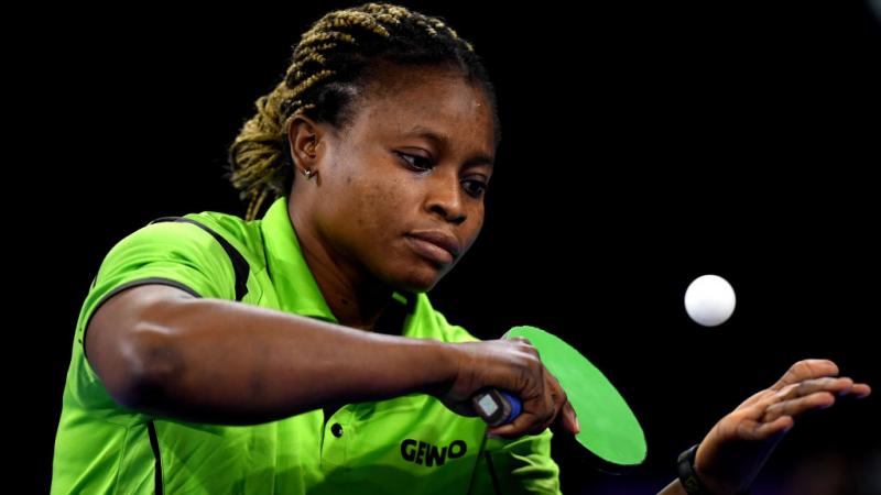 A female table tennis player serves during a match at the Birmingham 2022 Commonwealth Games.