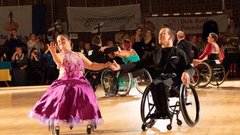 A female and a male wheelchair dancers in a Para dance sport competition