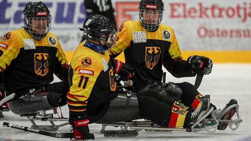 Three German Para ice hockey players on ice