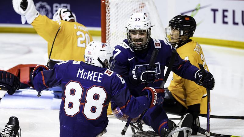 Two USA Para ice hockey players celebrating 