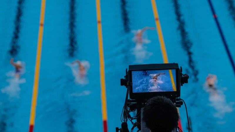 A camera showing a swimming competition