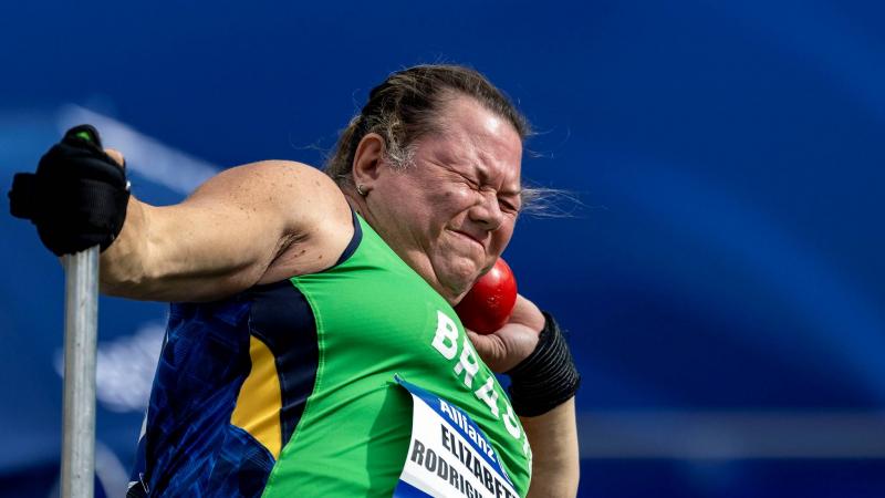 A female Para athlete competing in the shot put