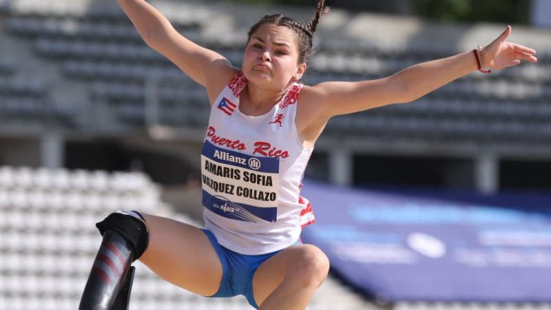 A female athlete competes in long jump.