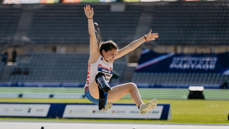 A female athlete wearing a blade compete in long jump
