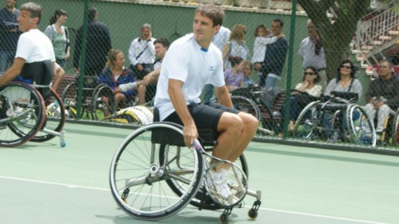 male tennis player Tommy Robredo in a wheelchair on the court