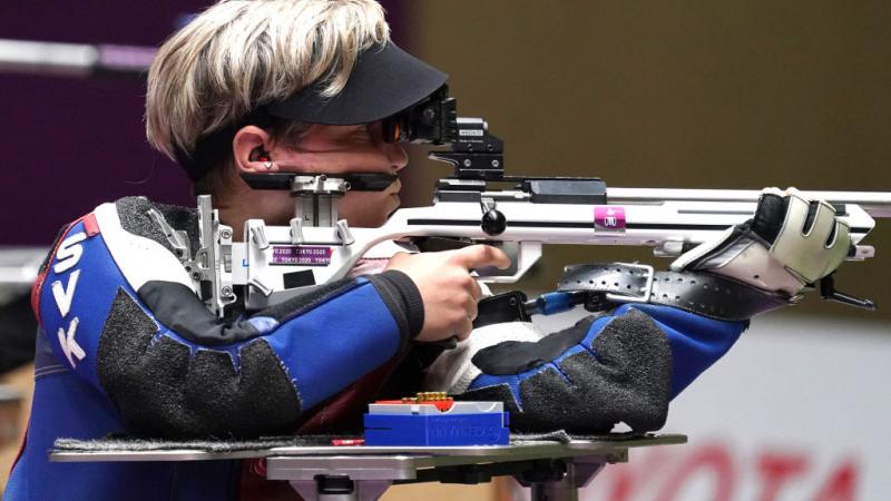 A female athlete competing in a shooting rifle event