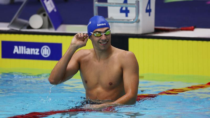 A male swimmer on a lane in the pool