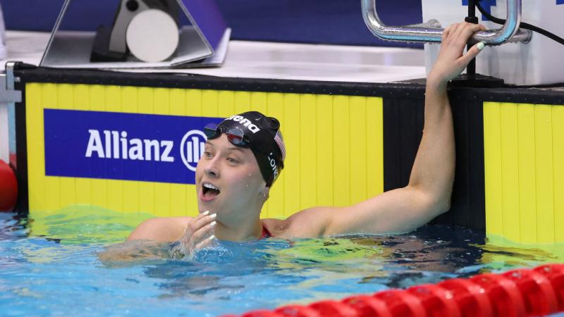 A female Para swimmer reaction surprised in the water