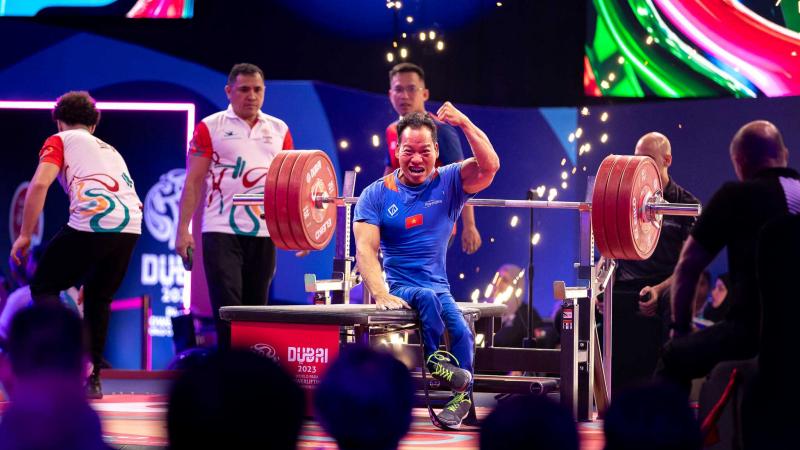 A powerlifter celebrates his win 