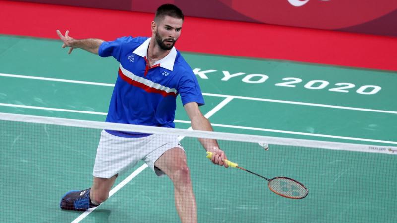 A male Para badminton player competes