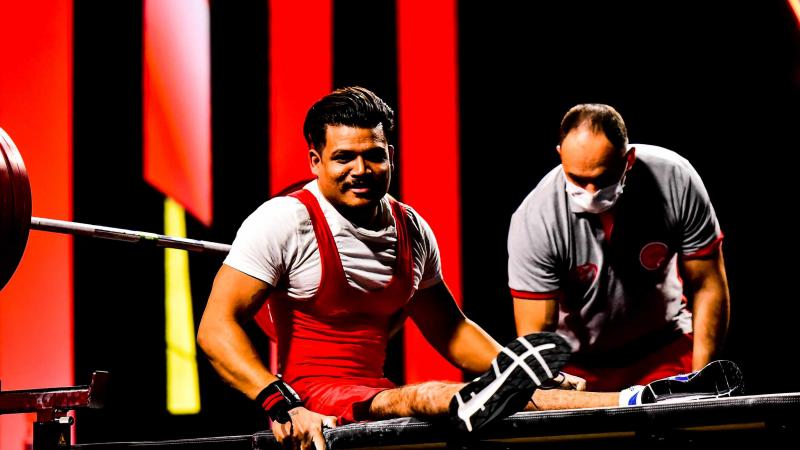 A Powerlifter in a bench after a successful lift.