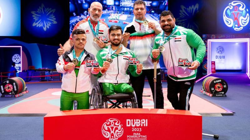 A group of five men on the podium of the Dubai 2023 Para Powerlifting World Championships