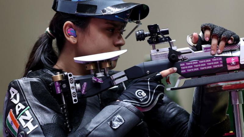 A female rifle shooter in a competition