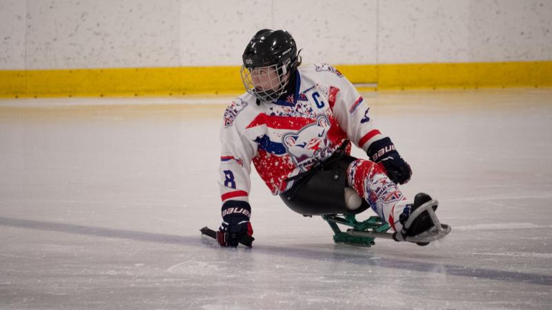 A female Para ice hockey player on ice