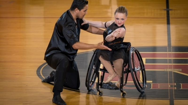 A female wheelchair dancer with a standing male partner