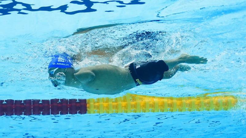 A male Para swimmer under water