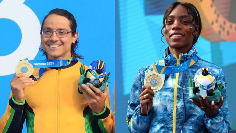 A man and a woman on the podium showing their gold medals