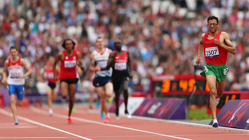 Para athlete El Amin Chentouf runs towards the finish line ahead of the field