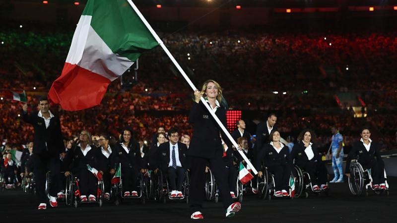 Para sprinter Martina Caironi carrying the Italian flag at the Paralympics Opening Ceremony