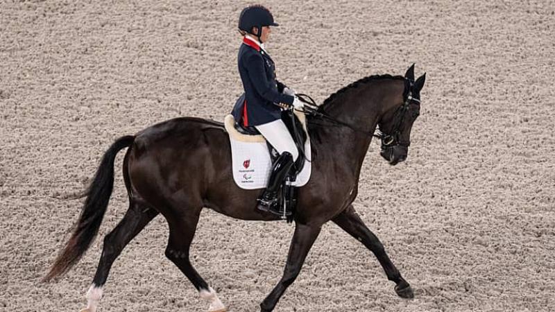 Para equestrian rider Sophie Wells riding a dressage horse