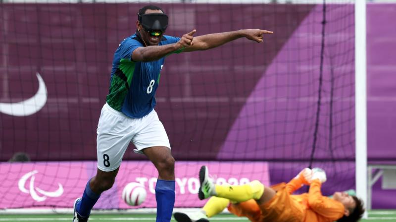 Raimundo 'Nonato' Mendes, a male blind football player from Brazil, celebrates after scoring a goal at the Tokyo 2020 Paralympics.