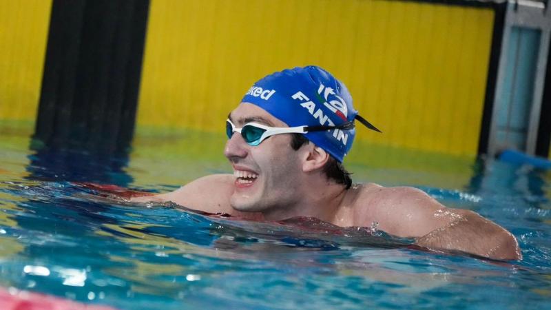 A swimmer celebrates after a race.   