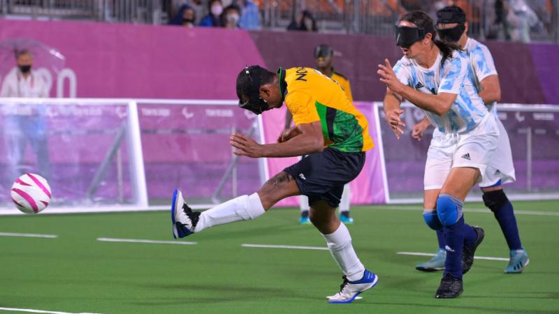 Brazilian blind footballer Raimundo Mendes scores a goal 